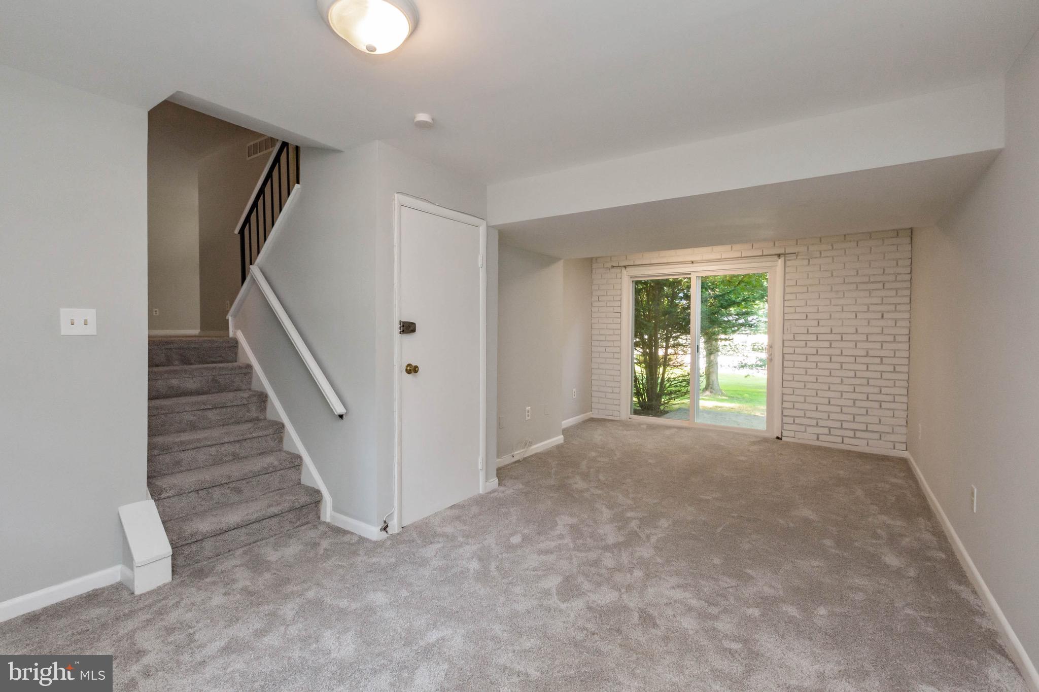 5441 Marsh Hawk Way Columbia, MD 21045 - Photo 29 of 42 Family room with slider to patio and back yard