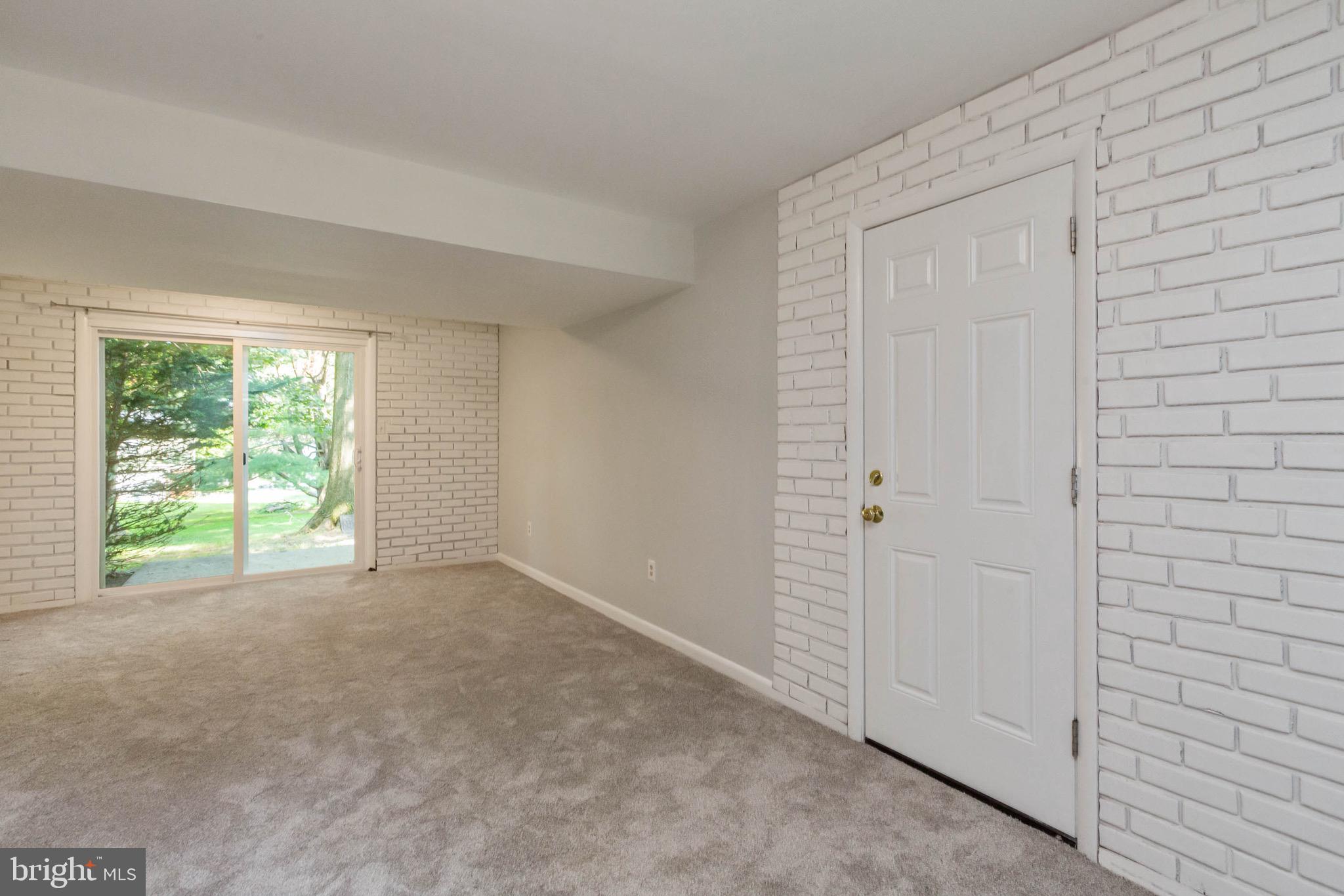 5441 Marsh Hawk Way Columbia, MD 21045 - Photo 30 of 42 Family room with one car garage and slider to back