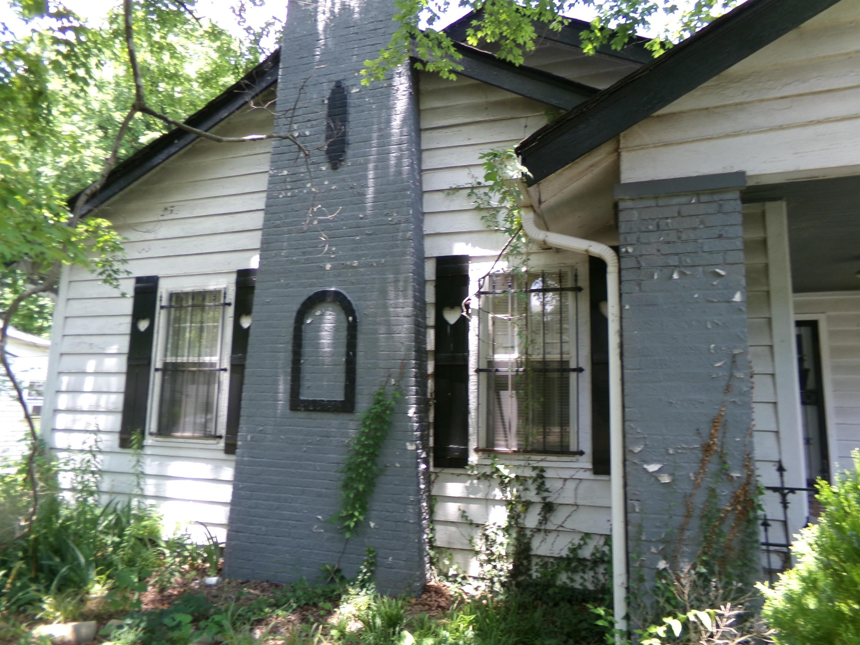 203 Division Avenue Jackson, TN 38301 - Photo 7 of 8 a front view of a house with a yard