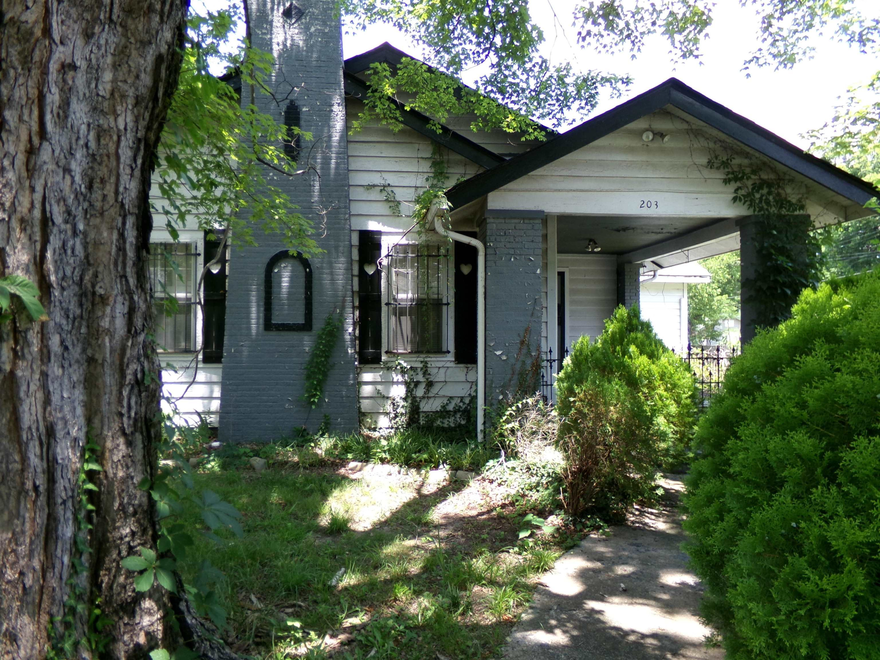 203 Division Avenue Jackson, TN 38301 - Photo 8 of 8 a front view of a house with a yard