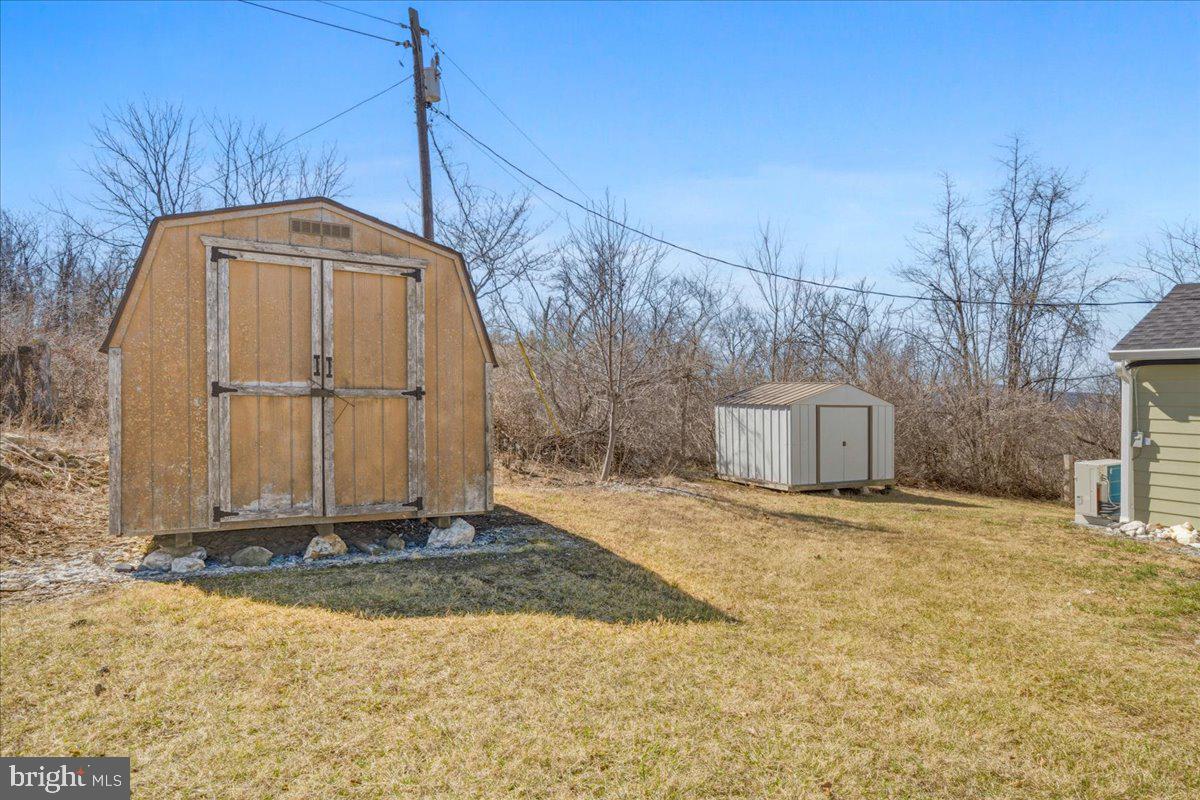 4835 Shookstown Road Frederick, MD 21702 - Photo 33 of 40 a front view of a house with a yard