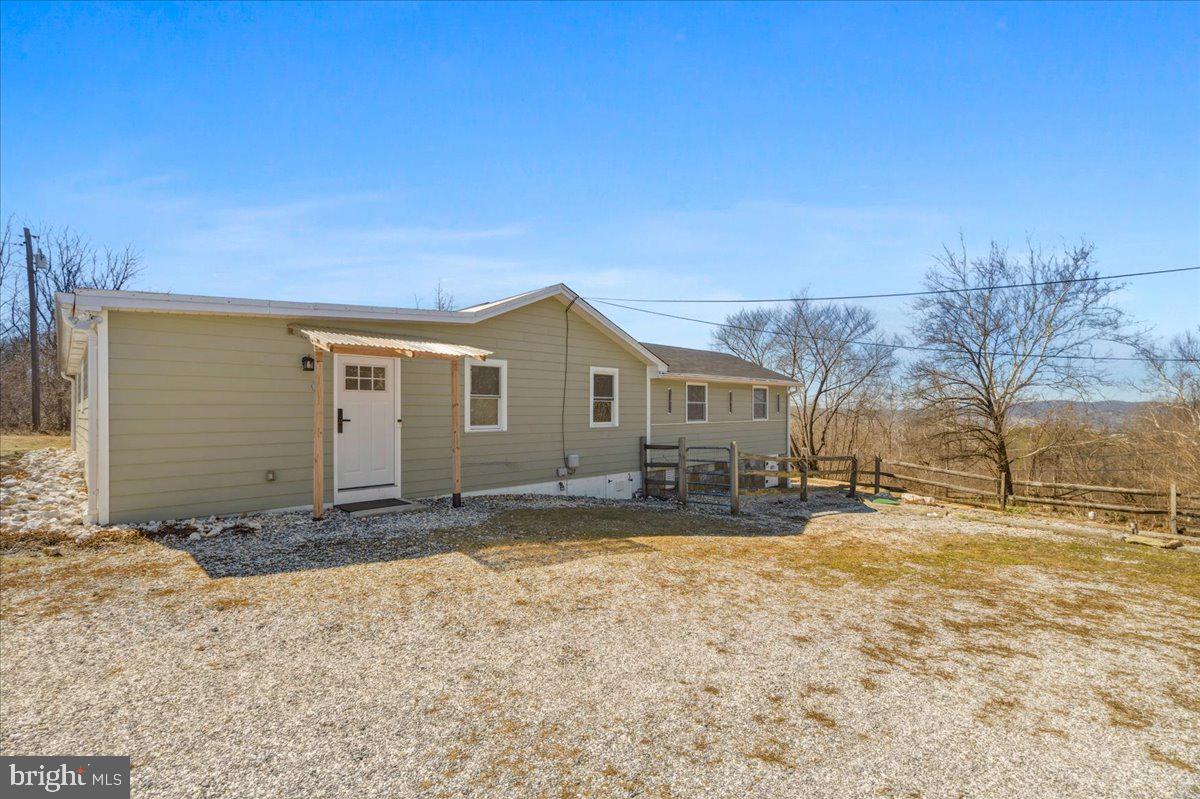 4835 Shookstown Road Frederick, MD 21702 - Photo 36 of 40 a view of a house with a yard covered in snow