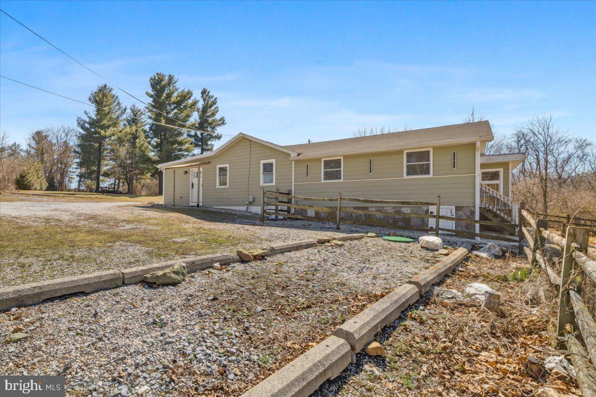4835 Shookstown Road Frederick, MD 21702 - Photo 37 of 40 a front view of a house with a yard