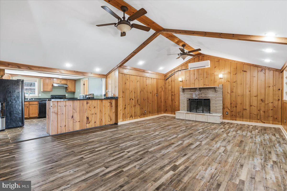 4835 Shookstown Road Frederick, MD 21702 - Photo 7 of 40 a view of a room with wooden floors and kitchen view