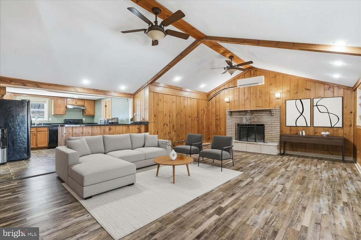 4835 Shookstown Road Frederick, MD 21702 - Photo 8 of 40 a living room with furniture and a fireplace