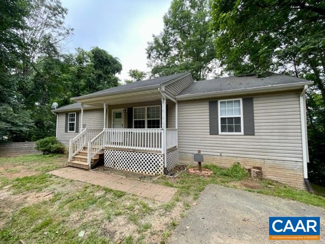 490 Jonquil Road Ruckersville, VA 22968 - Photo 17 of 18 a front view of a house with a garden