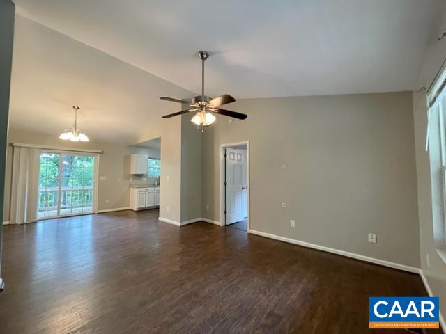 490 Jonquil Road Ruckersville, VA 22968 - Photo 4 of 18 a view of an empty room with wooden floor fridge and a window