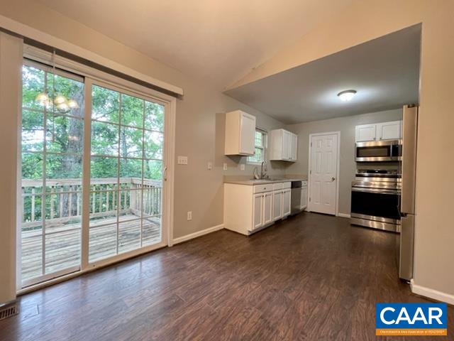 490 Jonquil Road Ruckersville, VA 22968 - Photo 6 of 18 a view of a kitchen with refrigerator and wooden floor