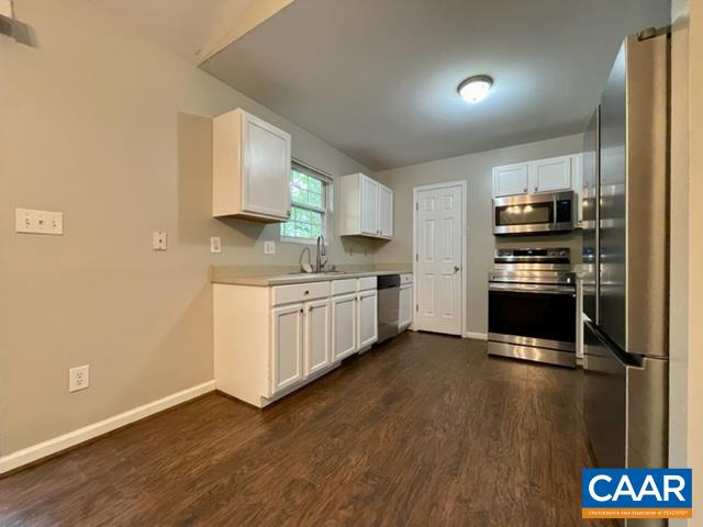490 Jonquil Road Ruckersville, VA 22968 - Photo 7 of 18 a kitchen with stainless steel appliances a stove a sink and a refrigerator