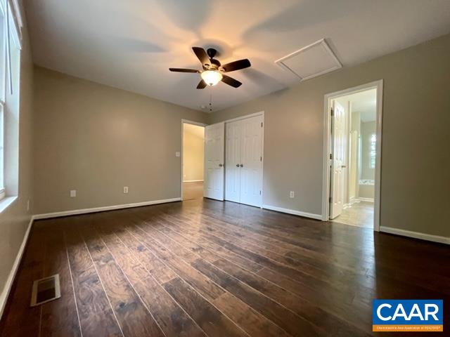 490 Jonquil Road Ruckersville, VA 22968 - Photo 8 of 18 a view of an empty room with wooden floor and a window