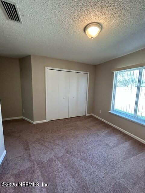 950 Wynfield Circle St. Augustine, FL 32092 - Photo 17 of 30 an empty room with a empty space and windows