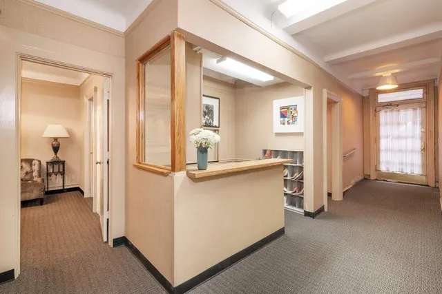 a workspace with furniture and a window