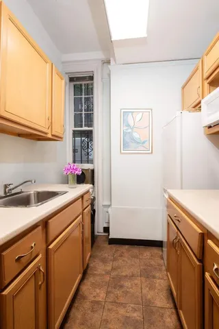 a view of hallway with livingroom and furniture