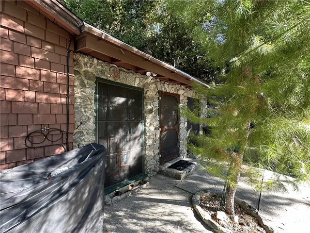 a view of a house with a tree