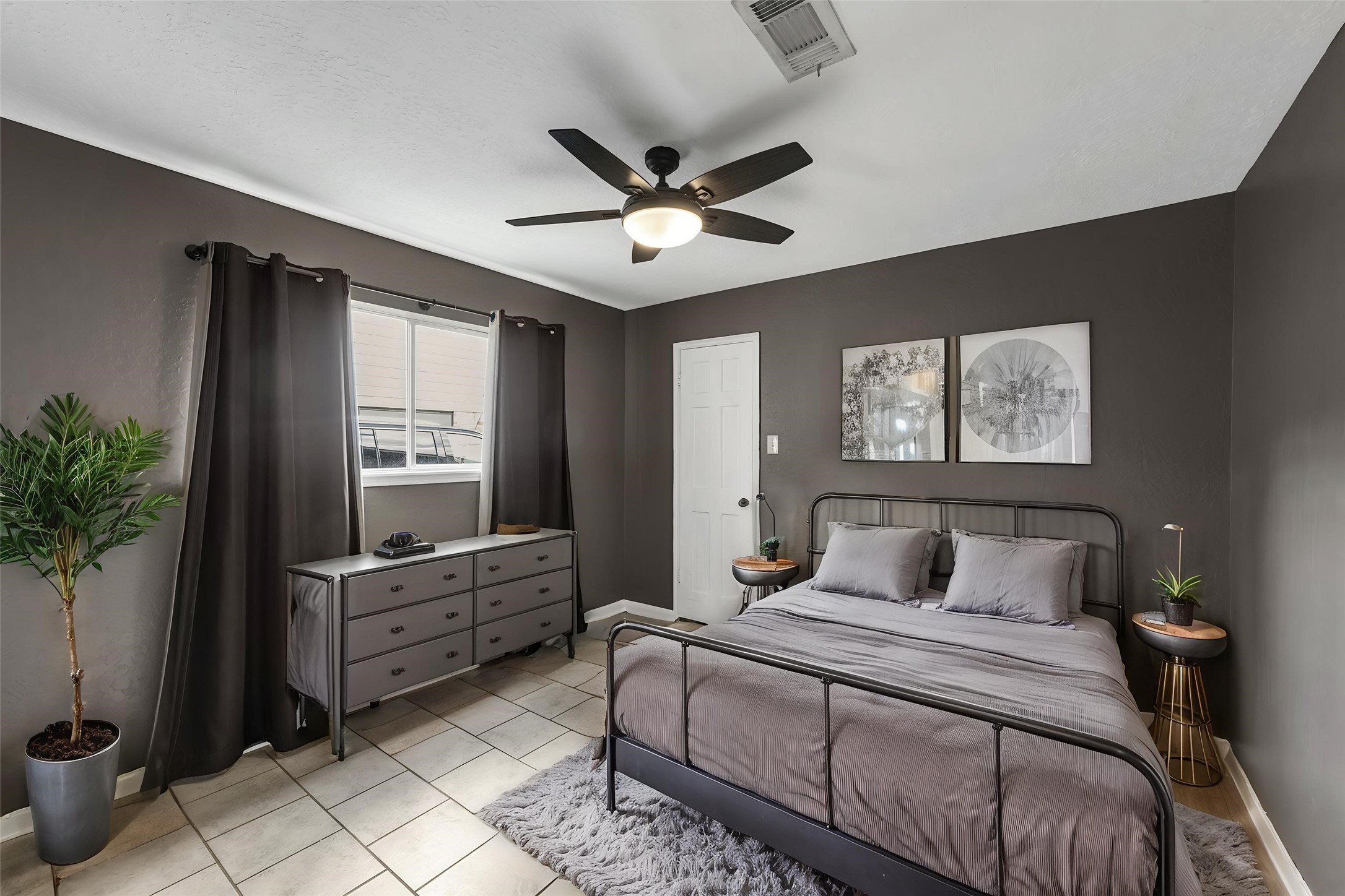 622 South Rivershire Drive Conroe, TX 77304 - Photo 33 of 44 a bedroom with a bed and a potted plant