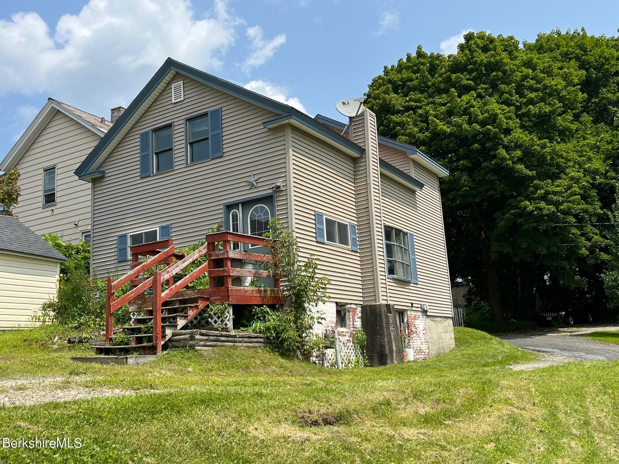 21 Ray Street North Adams, MA 01247 - Photo 2 of 27 a front view of house with yard and green space