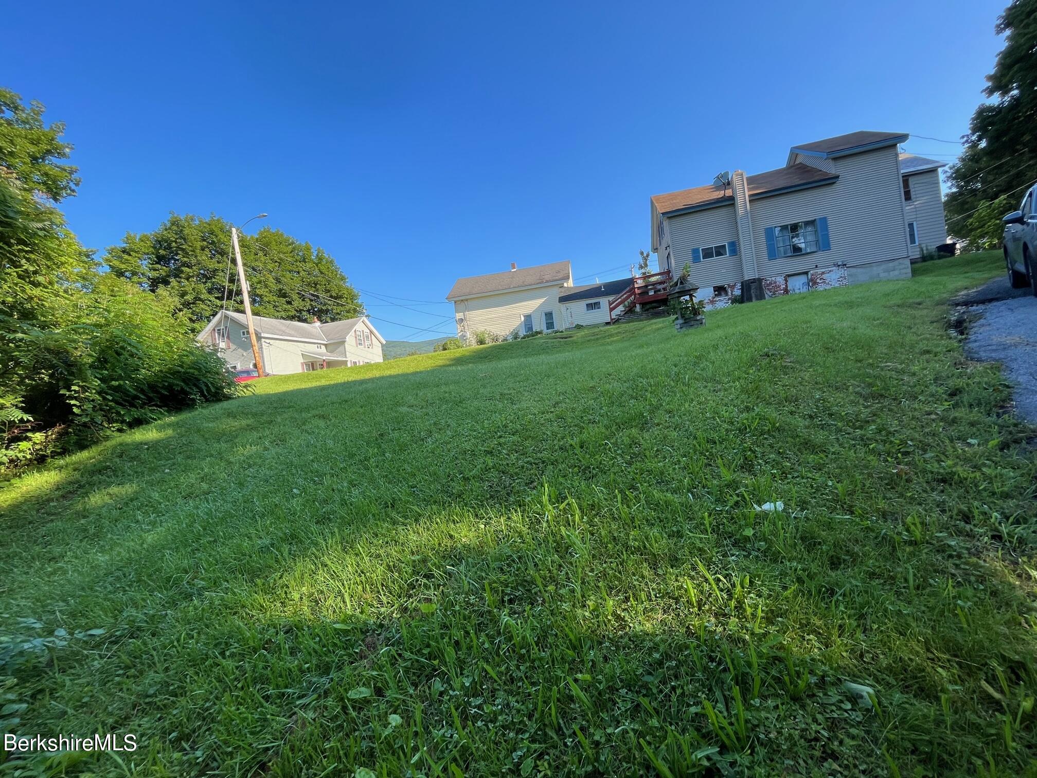 21 Ray Street North Adams, MA 01247 - Photo 25 of 27 a backyard of a house with lots of green space