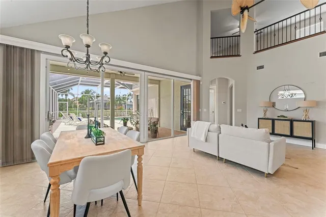 a view of a livingroom with a dinning table and workspace