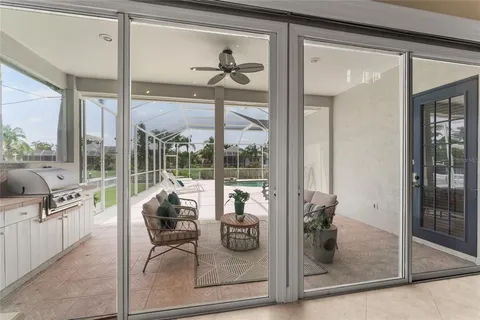 a bathroom with a granite countertop toilet a sink and a mirror