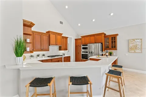 a bed room with a bed and a chandelier