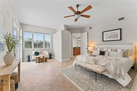 a view of an empty room with a ceiling fan