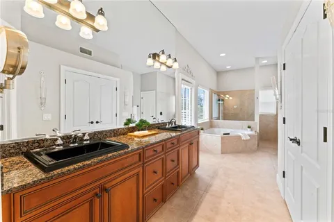 a living room with patio furniture and a floor to ceiling window