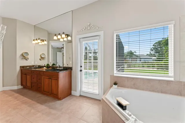 a view of a house with swimming pool and a yard