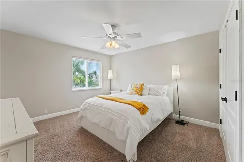 a view of a balcony with two chairs and a table