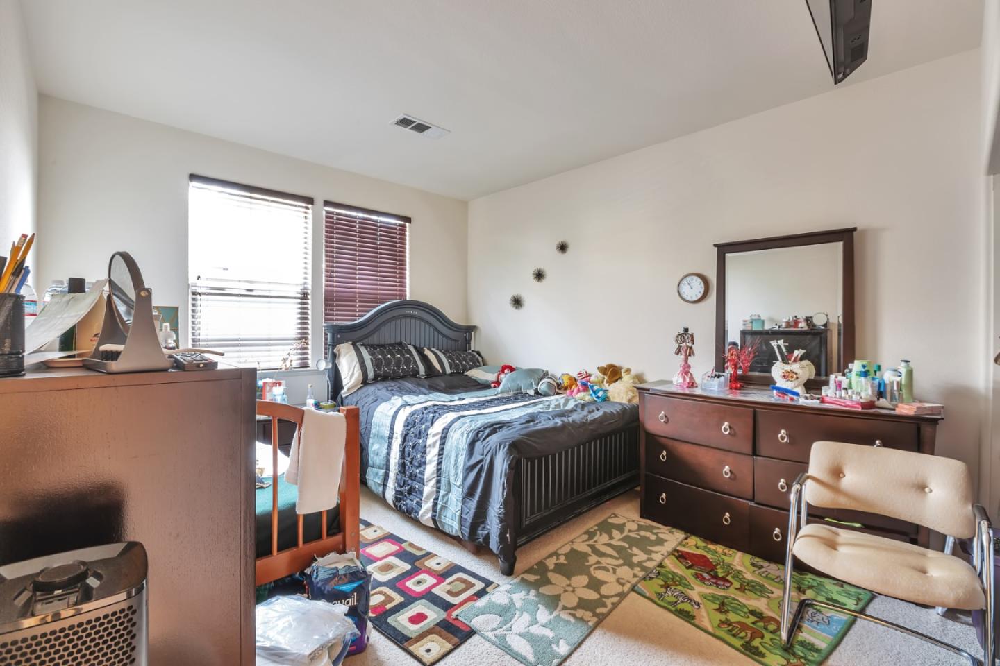 22860 Mono Street Hayward, CA 94541 - Photo 14 of 26 a bedroom with a bed and a dresser next to a window