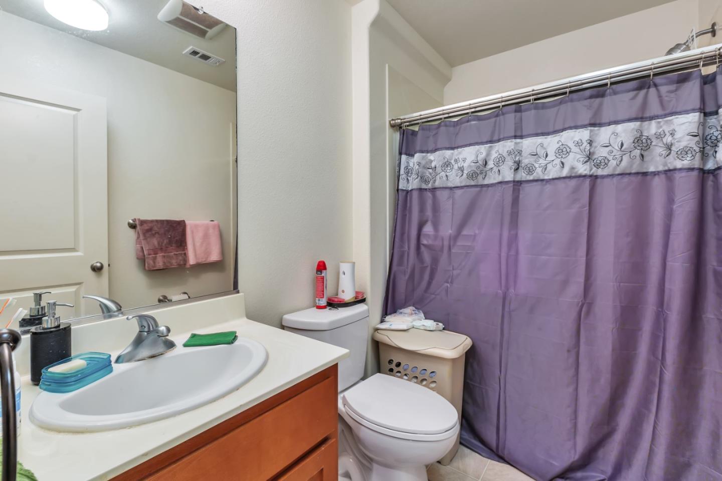 22860 Mono Street Hayward, CA 94541 - Photo 15 of 26 a bathroom with a sink a toilet and a mirror