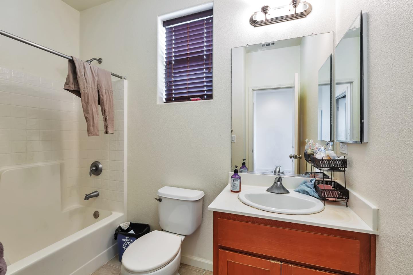 22860 Mono Street Hayward, CA 94541 - Photo 16 of 26 a bathroom with a sink toilet vanity and shower