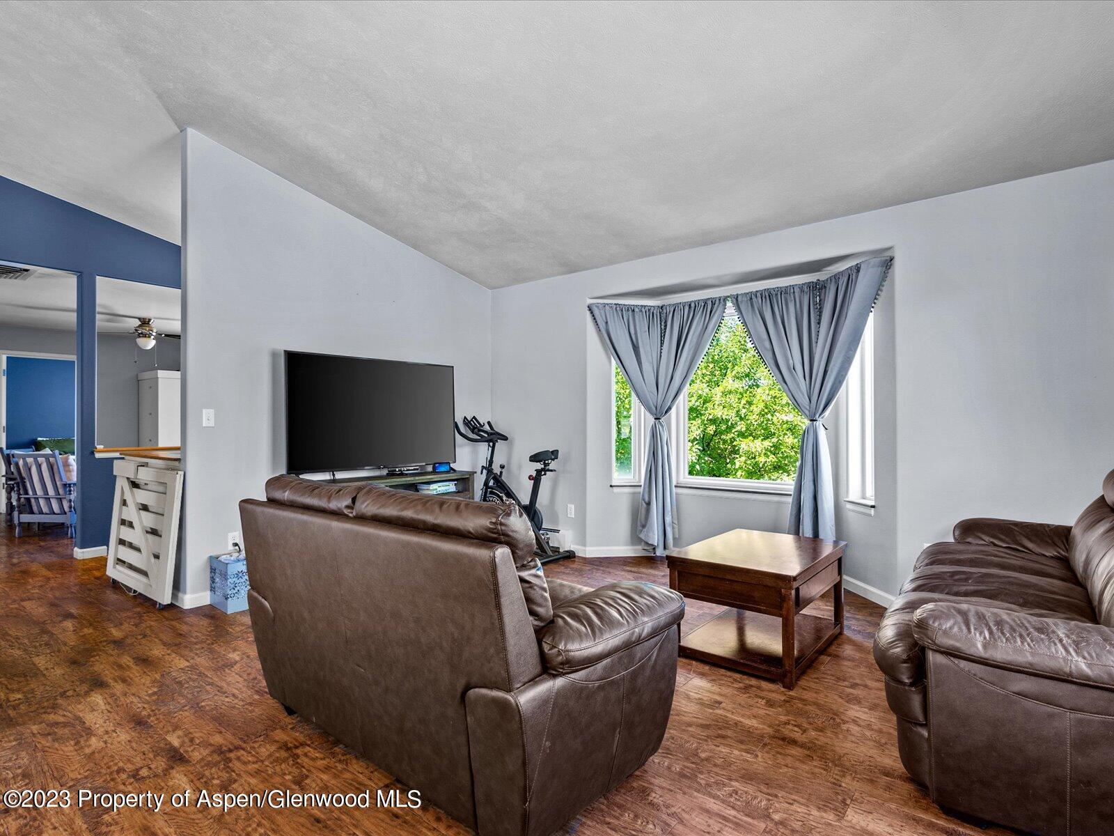 1562 Anvil View Avenue Rifle, CO 81650 - Photo 11 of 26 a living room with furniture and a flat screen tv