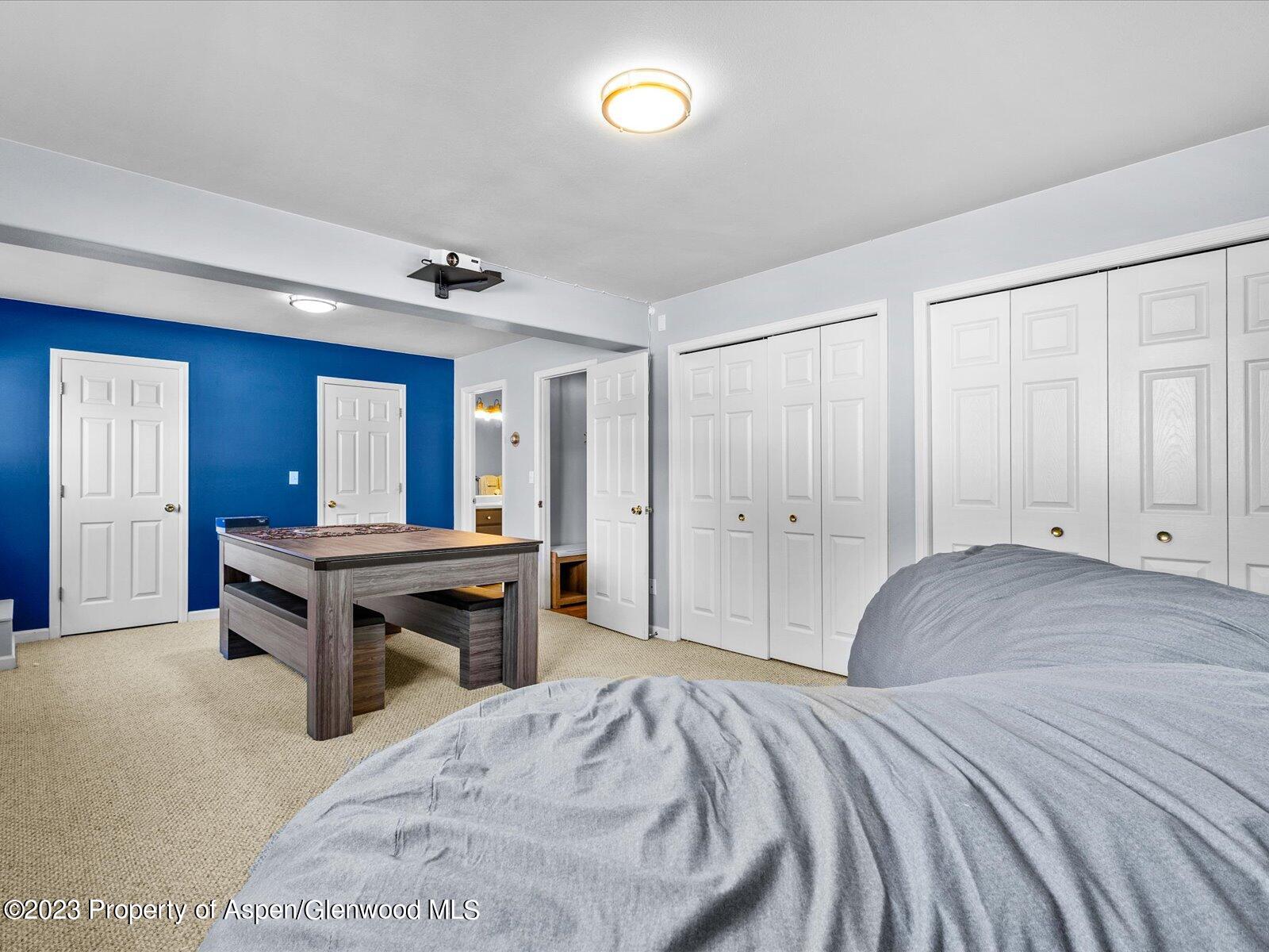 1562 Anvil View Avenue Rifle, CO 81650 - Photo 14 of 26 a bedroom with a bed and a table