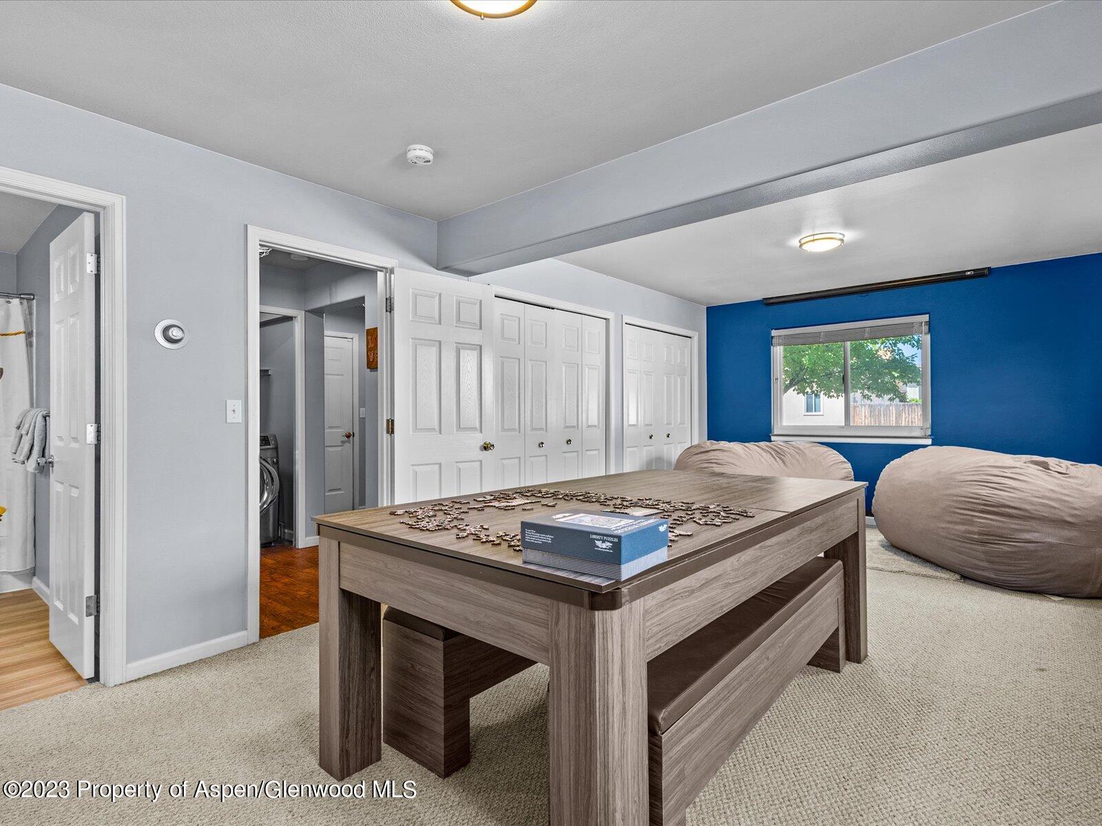 1562 Anvil View Avenue Rifle, CO 81650 - Photo 15 of 26 a bedroom with a bed and a table