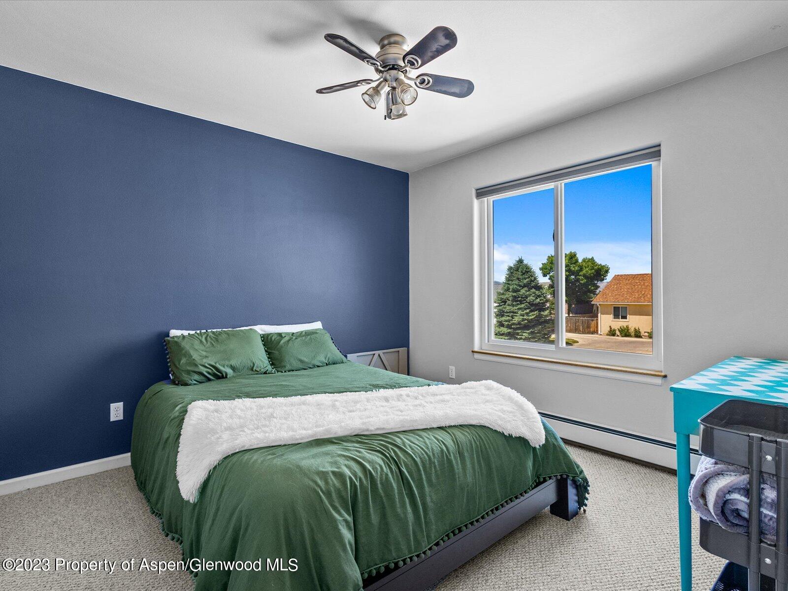1562 Anvil View Avenue Rifle, CO 81650 - Photo 17 of 26 a bedroom with a bed and a window