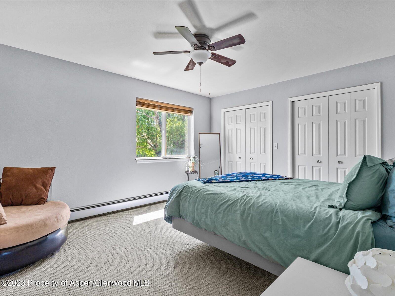 1562 Anvil View Avenue Rifle, CO 81650 - Photo 19 of 26 a living room with a bed furniture and a window