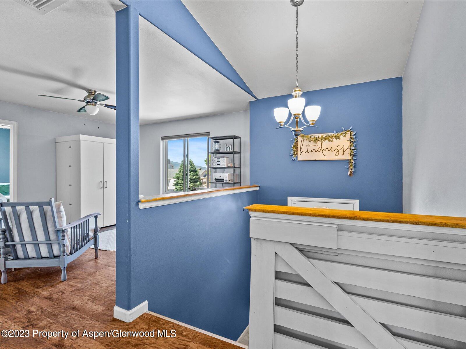 1562 Anvil View Avenue Rifle, CO 81650 - Photo 5 of 26 a view of kitchen with window and wooden floor