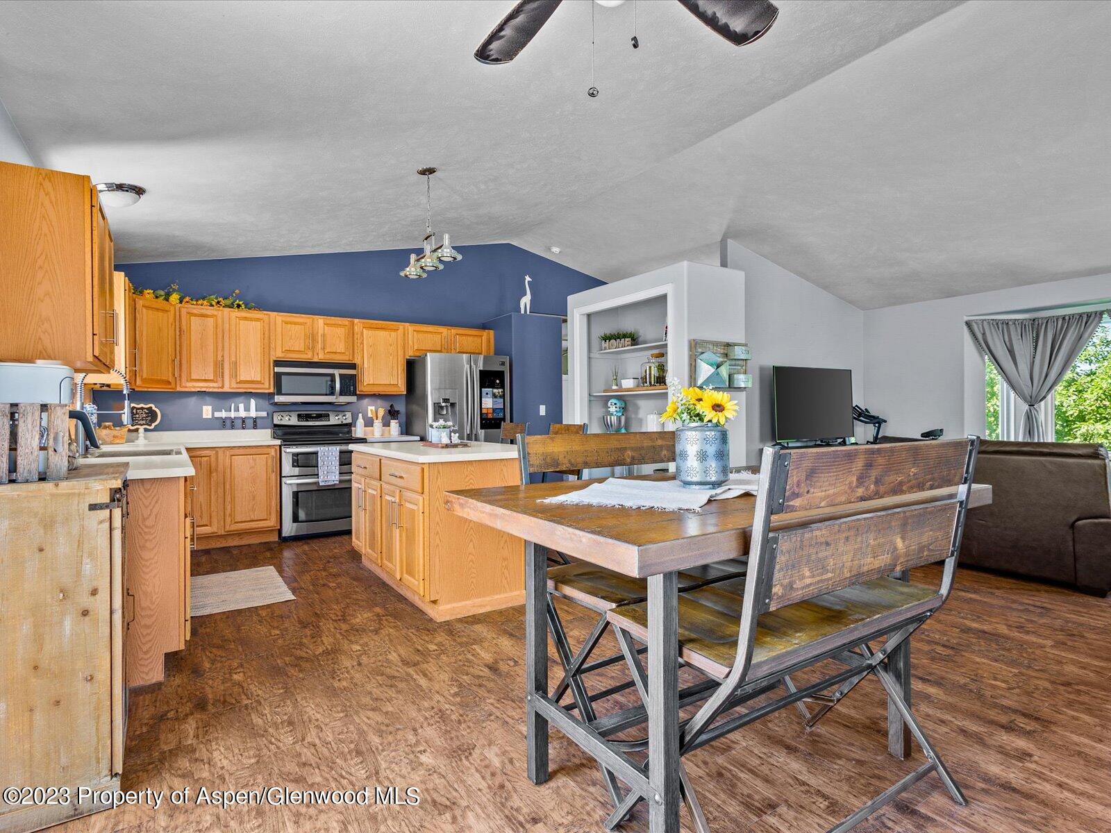 1562 Anvil View Avenue Rifle, CO 81650 - Photo 7 of 26 a kitchen that has a table and chairs in it