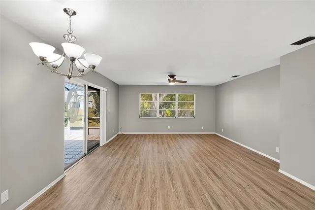 a view of a kitchen with wooden floor