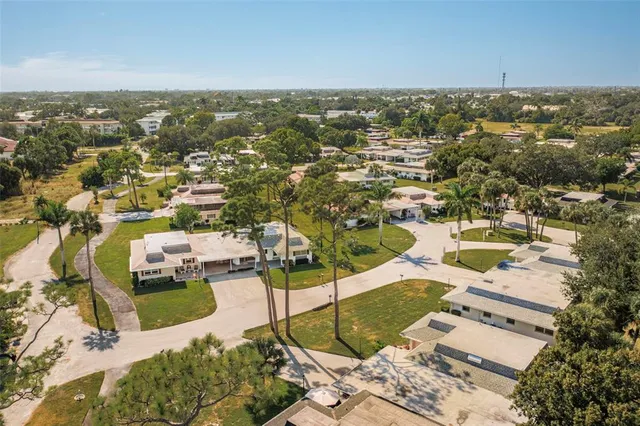an aerial view of residential houses with outdoor space