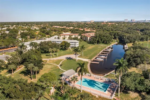 a kitchen with a sink a refrigerator and a stove top oven