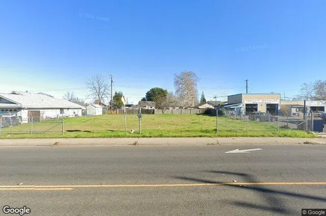 a view of a building with a yard
