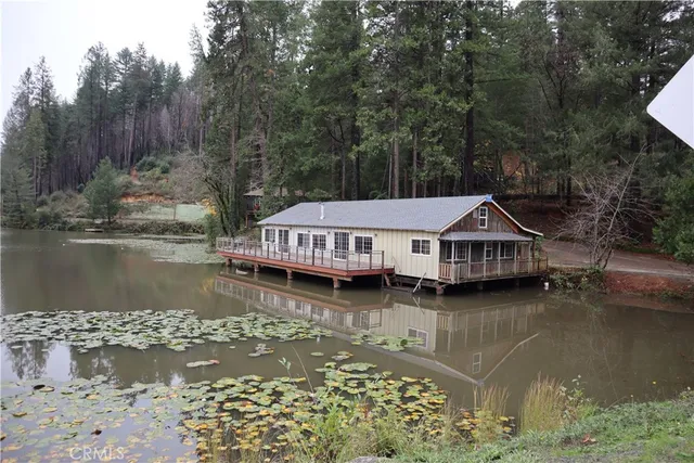 a view of a lake with a wooden deck and a lake view