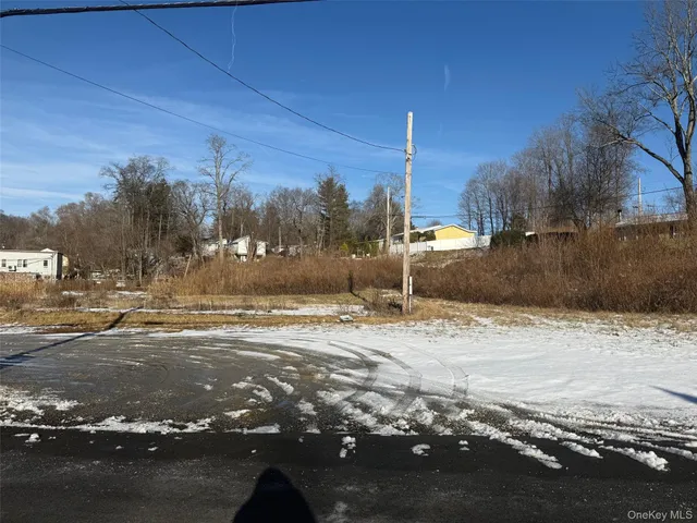 a view of a road with a building in the background