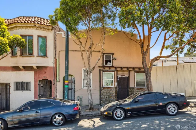 a car parked in front of a house