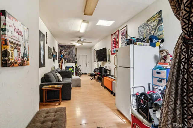 a kitchen with stainless steel appliances granite countertop a refrigerator and a stove