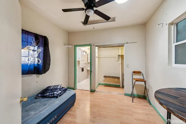 a bedroom with furniture and window