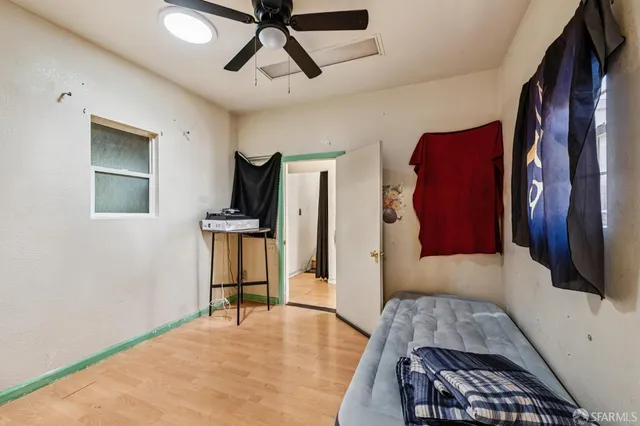 a bedroom with furniture and a window