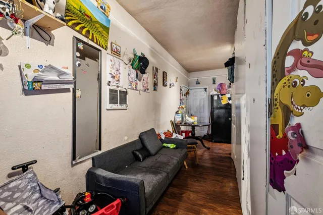 a living room with furniture and flowers