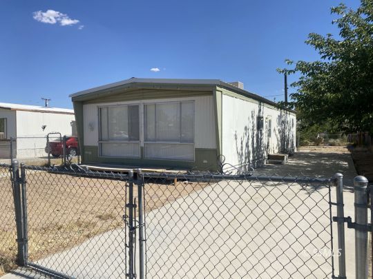 821 West Bennett Street Ridgecrest, CA 93555 - Photo 1 of 26 a front view of a house with street